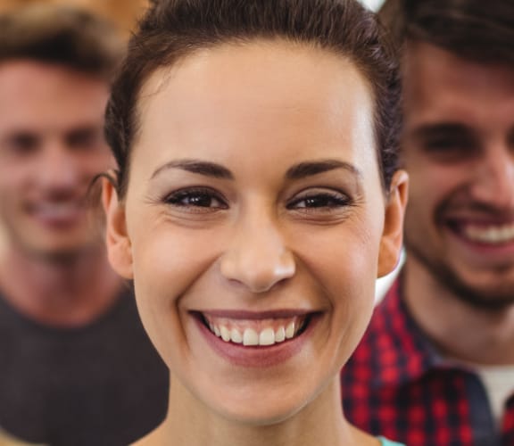 Group of people standing in an office